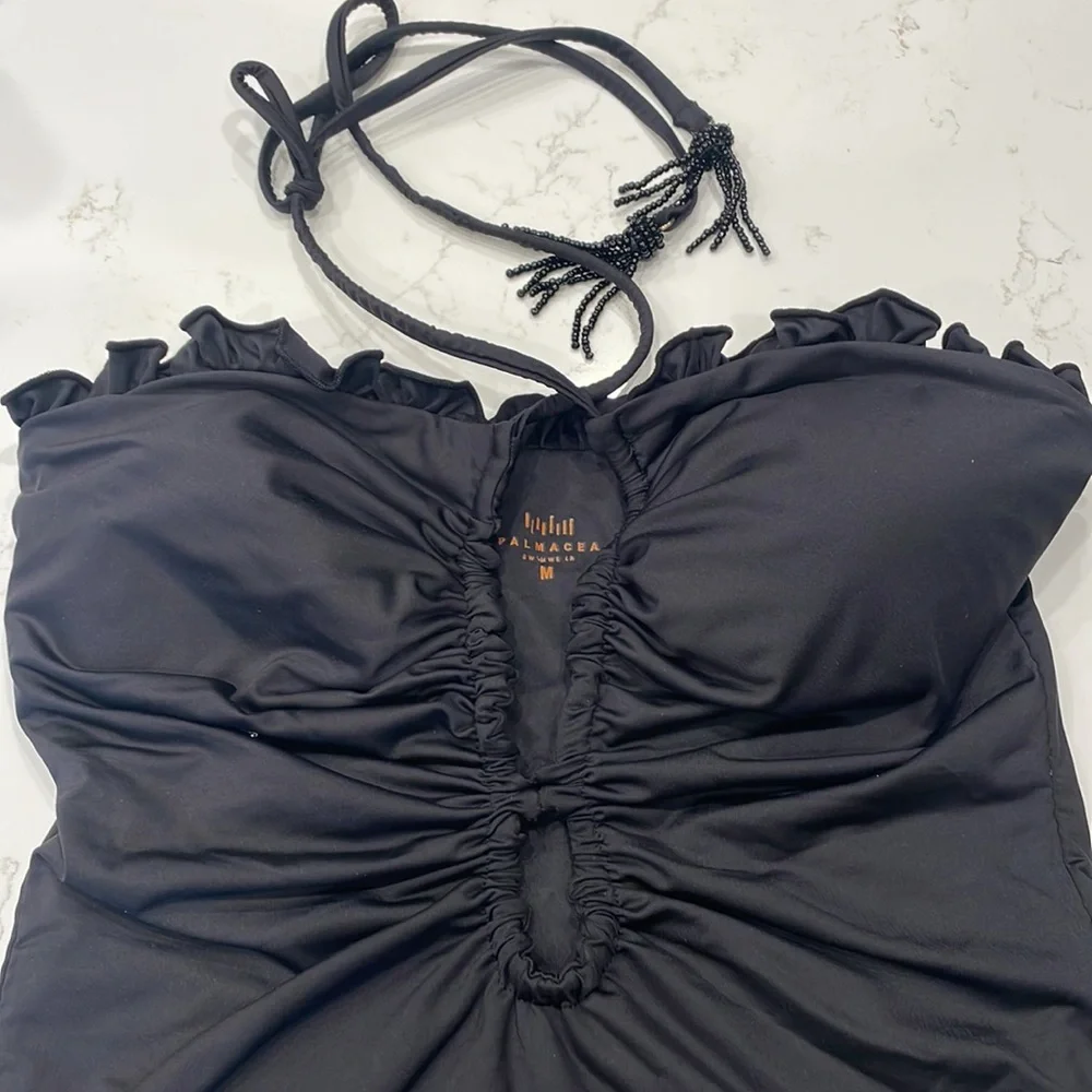 Palmacea, one piece, tied swimsuit with cut outs.
Size M - Picture 2 of 12